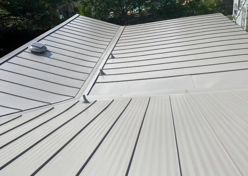 Solar attic fan installed on a metal roof for Roof Ventilation in Duvall
